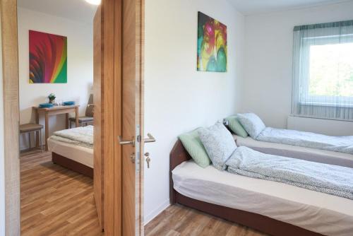 Postel nebo postele na pokoji v ubytování Thermal Apartman - EM