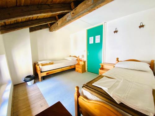 Casa delle Giuggiole tesisinde bir odada yatak veya yataklar