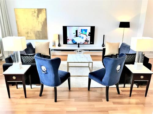 Televízia a/alebo spoločenská miestnosť v ubytovaní MONDRIAN Luxury Suites & Apartments Market Square I