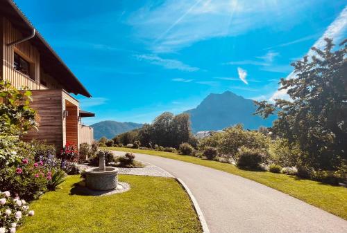 a winding road with a mountain in the background at KAINZLEITENHOF in Nachdemsee