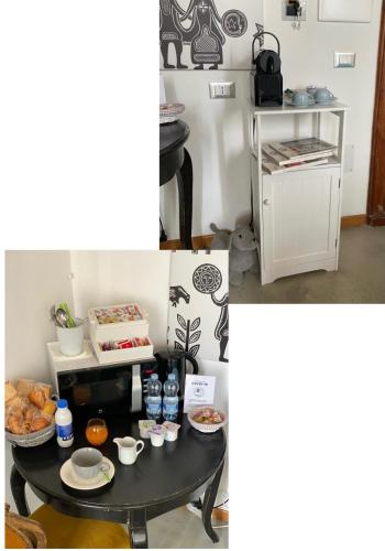a table with food and drinks on top of it at Palazzo Bolasco in Alghero