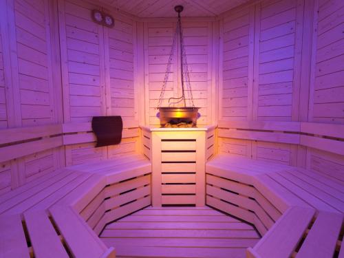 a room with a sauna with a light on it at Hotel Europeo Alpine Charme & Wellness in Pinzolo