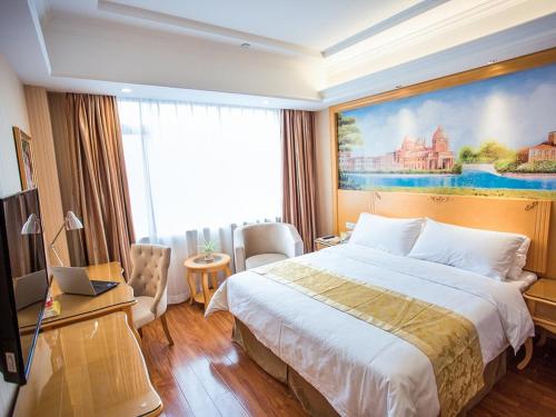 Ένα ή περισσότερα κρεβάτια σε δωμάτιο στο Vienna Hotel Pingxiang Lvyin Square