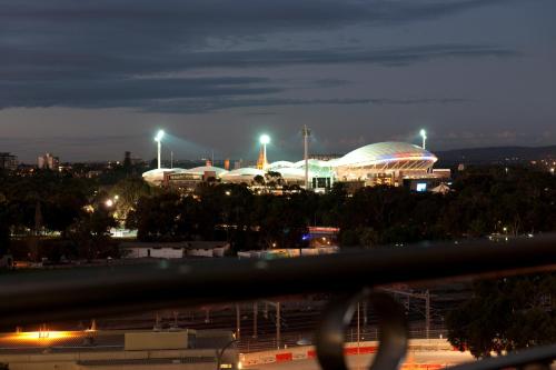 a view of a city at night at Adelaide Riviera Hotel in Adelaide
