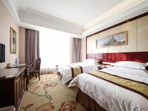 Posteľ alebo postele v izbe v ubytovaní Vienna Hotel Shanghai Hongqiao Convention & Exhibition Center