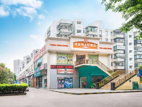 a large building with a staircase in front of it at Vienna 3 Best Hotel Shenzhen Shazui Road in Shenzhen