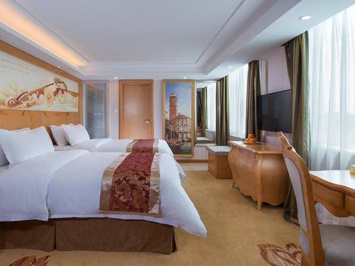 Ένα ή περισσότερα κρεβάτια σε δωμάτιο στο Vienna International Hotel Guangdong Foshan Shunde Ronggui