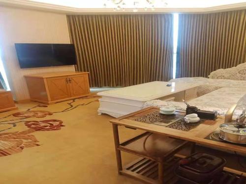 Ένα ή περισσότερα κρεβάτια σε δωμάτιο στο Vienna Hotel Liaocheng University