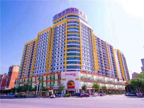 a large building with many windows in a city at Vienna Hotel Guilin MIXC Mall in Guilin