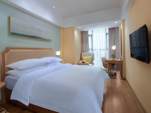 Katil atau katil-katil dalam bilik di Vienna Hotel (Dongmin Road Nanning)