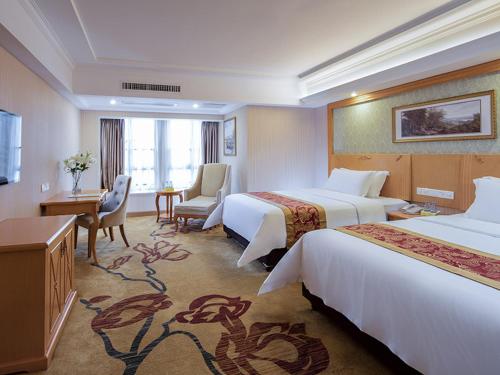 Katil atau katil-katil dalam bilik di Vienna International Hotel Zhongshan Torch Development Zone