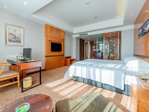 Cama o camas de una habitación en Vienna Hotel Dongguan Tangxia Binfen Plaza