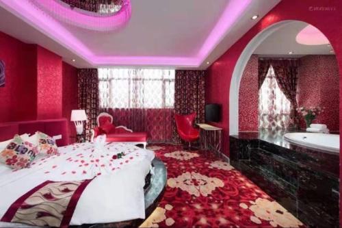 Ένα ή περισσότερα κρεβάτια σε δωμάτιο στο Vienna Hotel Zhongshan XiaoLan