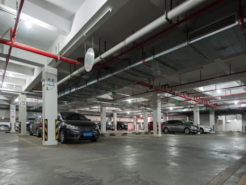 a parking garage with several cars parked in it at Vienna Hotel Foshan Lingnan Pearl Gymnasium Branch in Foshan