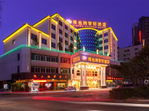 a large building with lights on top of it at night at Vienna Classic Hotel Foshan Nanhai Xijiao in Nanhai