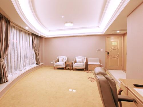 a room with chairs and a table and a window at Vienna Hotel Shanghai Songjiang Development Zone in Songjiang