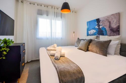 En eller flere senge i et værelse på Yalarent Morning Star-Garden with Private Pool