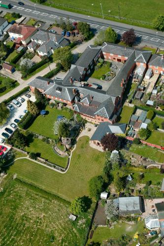 an overhead view of a residential neighborhood with houses at Best Western Sysonby Knoll Hotel in Melton Mowbray