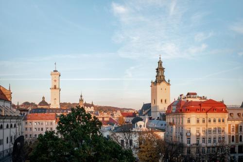 a view of a city with two tall buildings at Grand Hotel Lviv Casino & Spa in Lviv