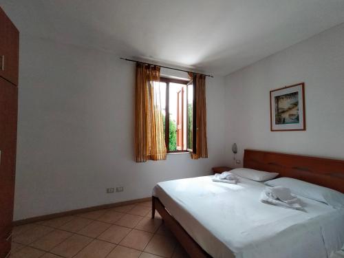 Ένα ή περισσότερα κρεβάτια σε δωμάτιο στο borgo antico