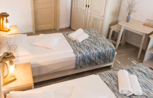 Postel nebo postele na pokoji v ubytování Pensiunea NEST