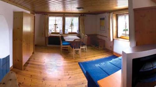a living room with a couch and a table at edelweiss lounge restaurant hotel pizza cafe billard gasthof in Mayrhofen