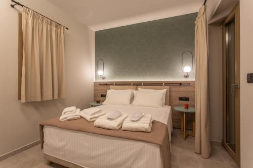 Ένα ή περισσότερα κρεβάτια σε δωμάτιο στο Quinta Essentia Suites