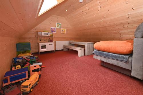 a room with a bedroom with a bed and a desk at Der BiscHOF in Mellau