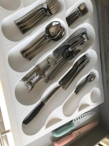 a drawer filled with lots of kitchen utensils at Cosy studio 35m2 in Síndos