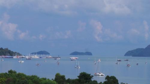 a group of boats in a large body of water at Hotel Langkasuka Langkawi in Kuah