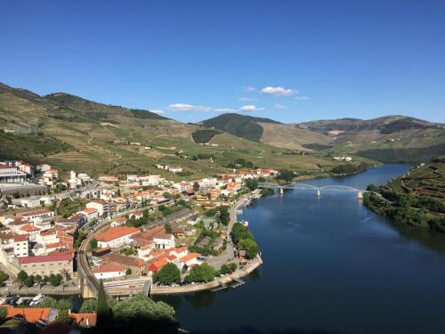 an aerial view of a town next to a river at Casa Seixas Batista in Pinhão