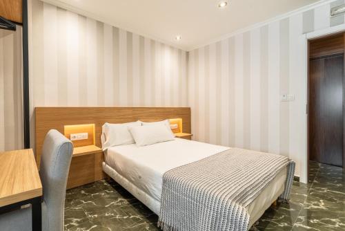 Кровать или кровати в номере Hotel Condado Ourense