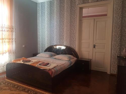 Кровать или кровати в номере Guest House Adigeni