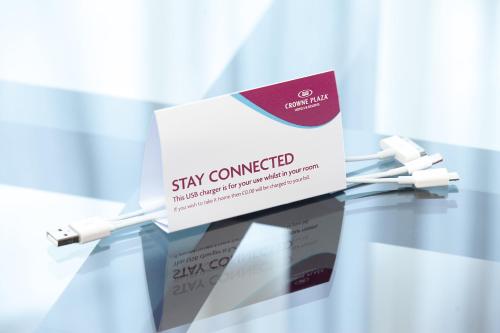 a sign on a glass table with a thermometer at Crowne Plaza Marlow by IHG in Marlow