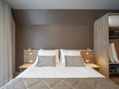 Ліжко або ліжка в номері Golden Gramado Laghetto Resort