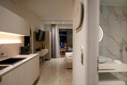 a kitchen with a sink and a counter top at B&D Luxury Suites in Skala Potamias