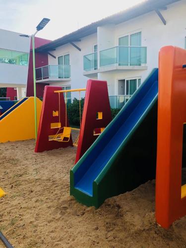 a group of playground equipment in the sand at Reserve Hotel in Surubim