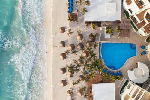 an overhead view of the beach and the ocean at Hotel NYX Cancun in Cancún