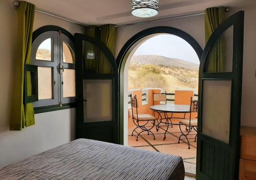 A bed or beds in a room at Gîte Forest Kasbah