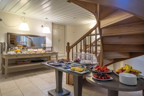 a kitchen with a buffet of food on a table at Grand Sarai Nafplio in Nafplio