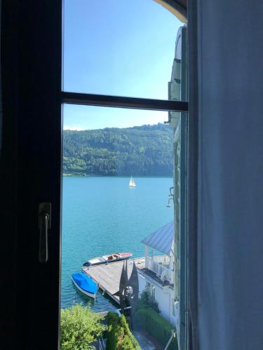a view of a lake from a window at Villa Streintz in Millstatt