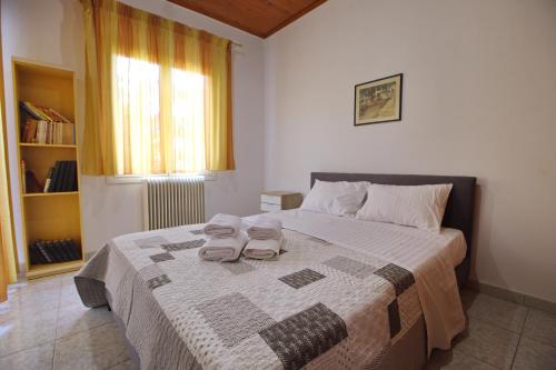 En eller flere senger på et rom på Villa Ioanna