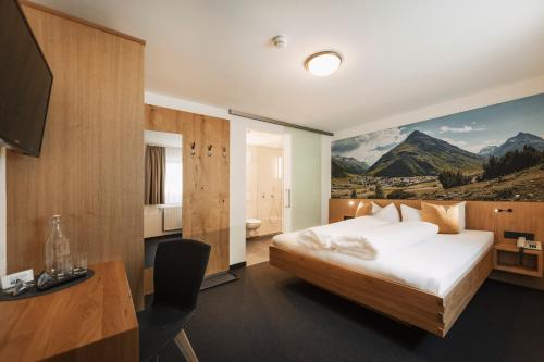 Postel nebo postele na pokoji v ubytování Apart Garni St Martin - Silvretta Card Premium Betrieb