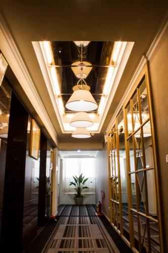 a hallway of an office building with a potted plant at Cambridge Tainan Hotel in Tainan
