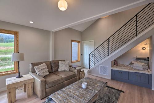 a living room with a couch and a staircase at Modern Evergreen Duplex Directly Off I-70! in Idaho Springs