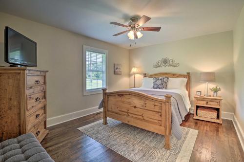 a bedroom with a bed and a ceiling fan at Idyllic Getaway with Deck about 4 Mi to Dtwn Athens in Athens