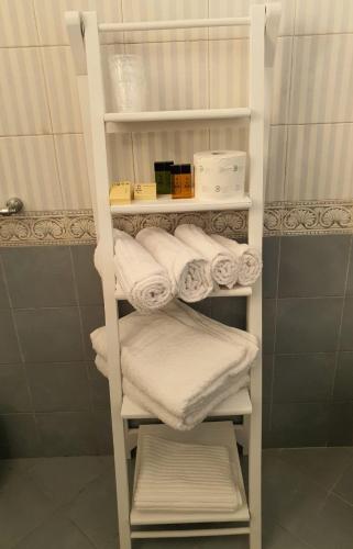 a towel rack with towels on it in a bathroom at B&B METRO' in Perugia