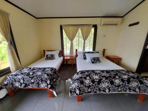 Ein Bett oder Betten in einem Zimmer der Unterkunft Casita Génesis - Bahia Drake Bay