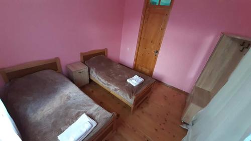 an overhead view of a room with two beds at Guest house-Lile in Mestia