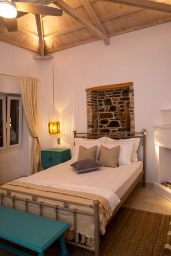 a bedroom with a large bed in a room at Villa Kyani in Skopelos Town
